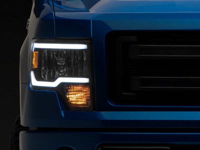 Load image into Gallery viewer, Raxiom 09-14 Ford F-150 Axial Series Headlights w/ LED Bar- Black Housing (Clear Lens)