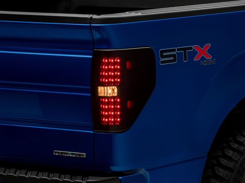 Load image into Gallery viewer, Raxiom 09-14 Ford F-150 Styleside Axial Series LED Tail Lights- Blk Housing (Smoked Lens)