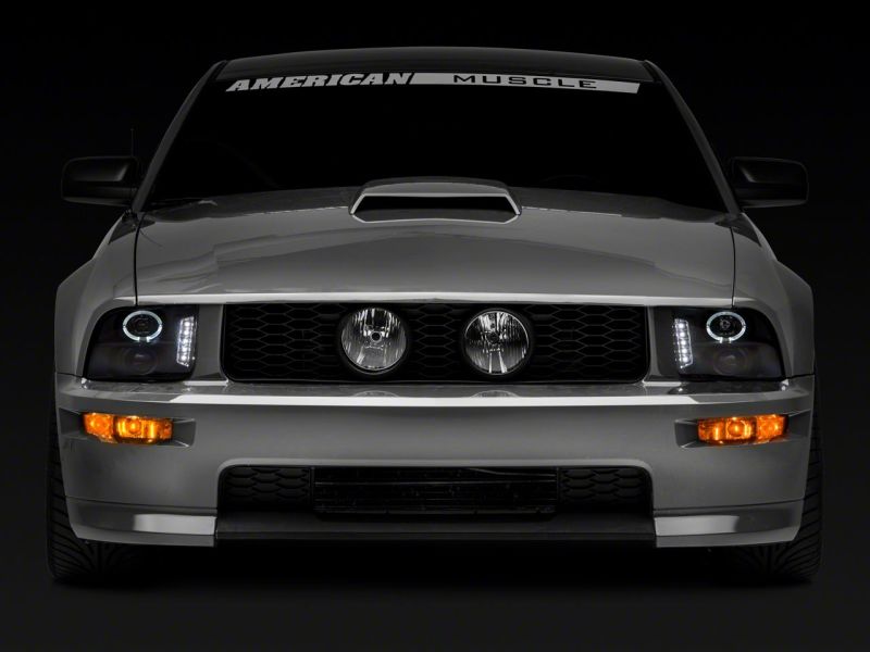 Load image into Gallery viewer, Raxiom 05-09 Ford Mustang Excluding GT500 LED Halo Projector Headlights- Black Housing (Clear Lens)