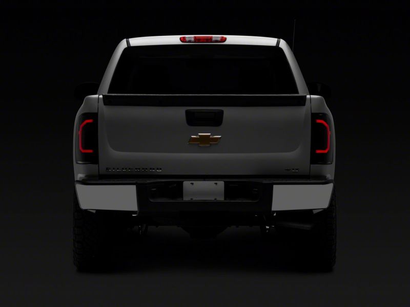 Load image into Gallery viewer, Raxiom 07-14 Chevrolet Silverado 1500 Axial Series LED Tail Lights- Blk Housing (Smoked Lens)