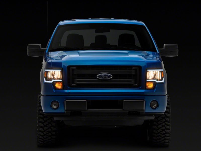 Load image into Gallery viewer, Raxiom 09-14 Ford F-150 Axial Series Headlight w/ SEQL LED Bar- Black Housing (Clear Lens)