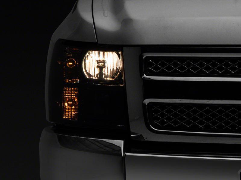 Load image into Gallery viewer, Raxiom 07-14 Chevrolet Silverado 1500 HD Axial OEM Rep Headlights- Chrome Housing- Smoked Lens