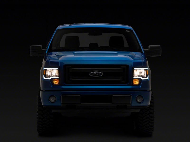 Load image into Gallery viewer, Raxiom 09-14 Ford F-150 Axial Series Headlights w/ LED Bar- Black Housing (Clear Lens)