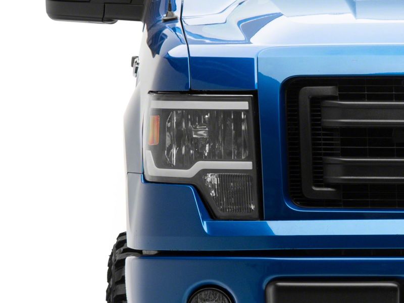 Load image into Gallery viewer, Raxiom 09-14 Ford F-150 Axial Series Headlight w/ SEQL LED Bar- Black Housing (Clear Lens)