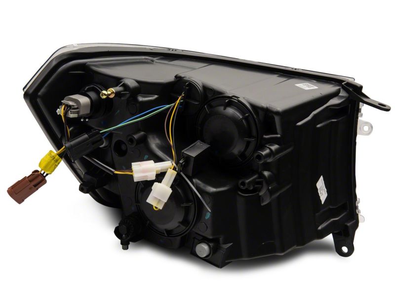 Load image into Gallery viewer, Raxiom 09-18 Dodge RAM 1500/2500/3500 Axial Headlights w/ SEQL LED Bar- Black Housing (Clear Lens)