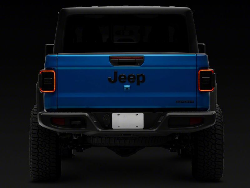 Load image into Gallery viewer, Raxiom 20-23 Jeep Gladiator JT w/ Factory Halogen LED Tail Lights- Blk Housing (Smoked Lens)