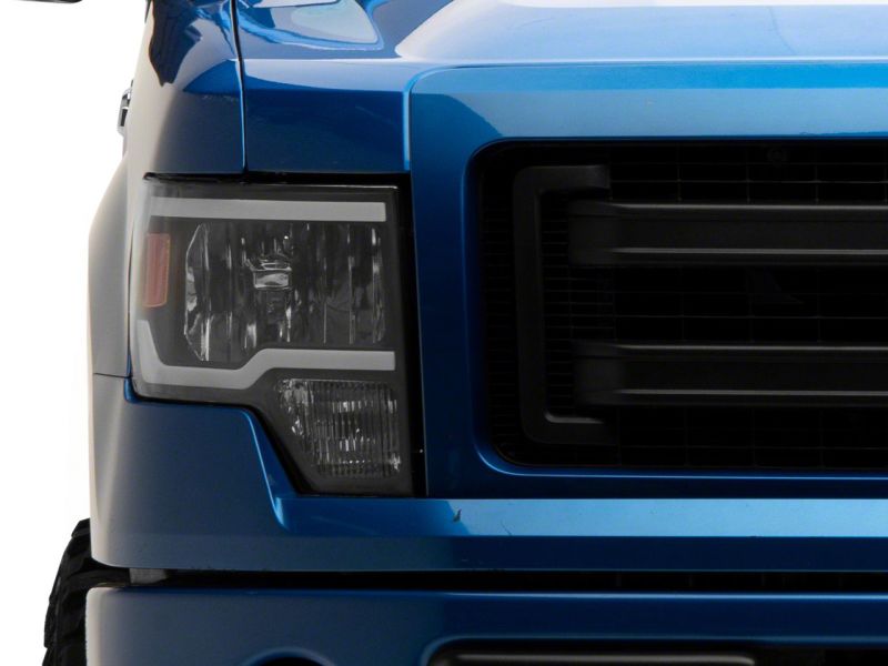 Load image into Gallery viewer, Raxiom 09-14 Ford F-150 Axial Series Headlights w/ LED Bar- Black Housing (Clear Lens)