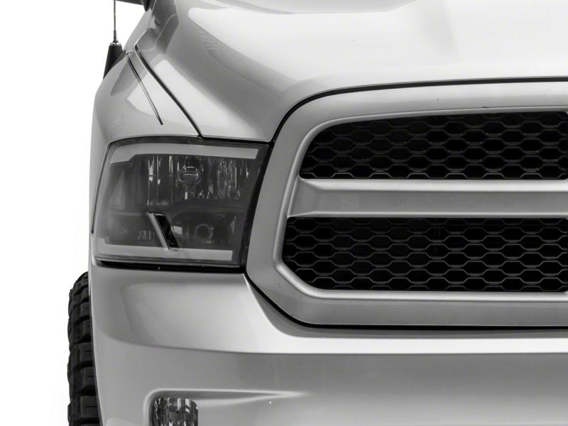 Load image into Gallery viewer, Raxiom 09-18 Dodge RAM 1500/2500/3500 Axial Series Headlights w/ LED Bar- Black Housing (Clear Lens)