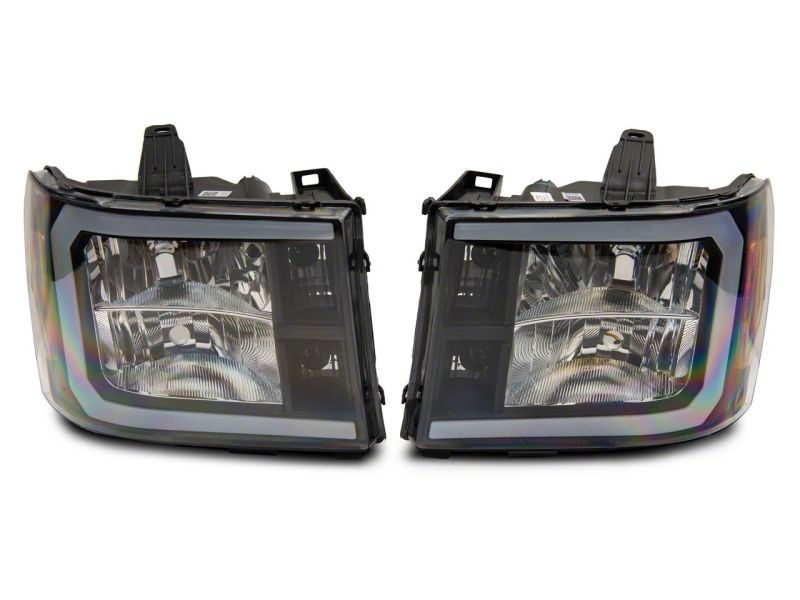 Load image into Gallery viewer, Raxiom 07-13 GMC Sierra 1500 Axial Series Headlights w/ LED Bar- Black Housing (Clear Lens)