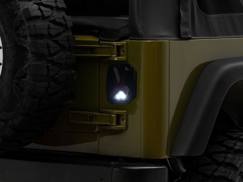 Load image into Gallery viewer, Raxiom 76-06 Jeep CJ7 Wrangler YJ & TJ Gladiator LED Tail Lights- Blk Housing (Smoked Lens)