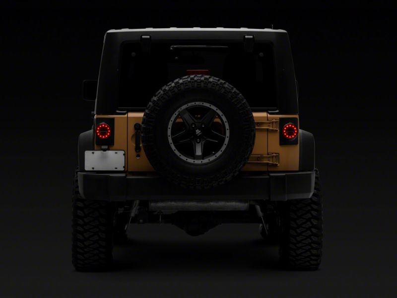 Load image into Gallery viewer, Raxiom 07-18 Jeep Wrangler JK Axial Series Halo LED Tail Lights- Blk Housing (Clear Lens)