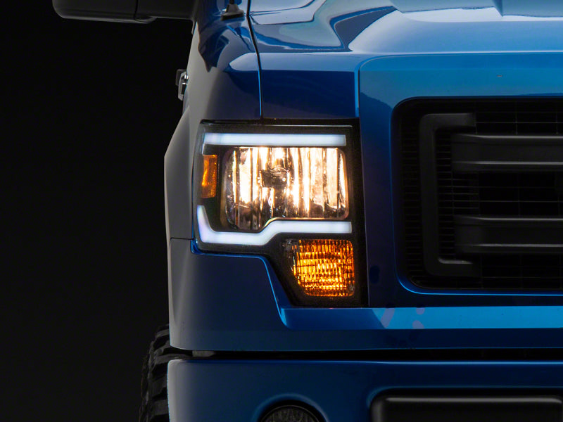 Load image into Gallery viewer, Raxiom 09-14 Ford F-150 Axial Series Headlight w/ SEQL LED Bar- Black Housing (Clear Lens)