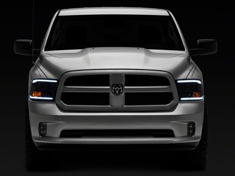 Load image into Gallery viewer, Raxiom 09-18 Dodge RAM 1500/2500/3500 Axial Series Headlights w/ LED Bar- Black Housing (Clear Lens)