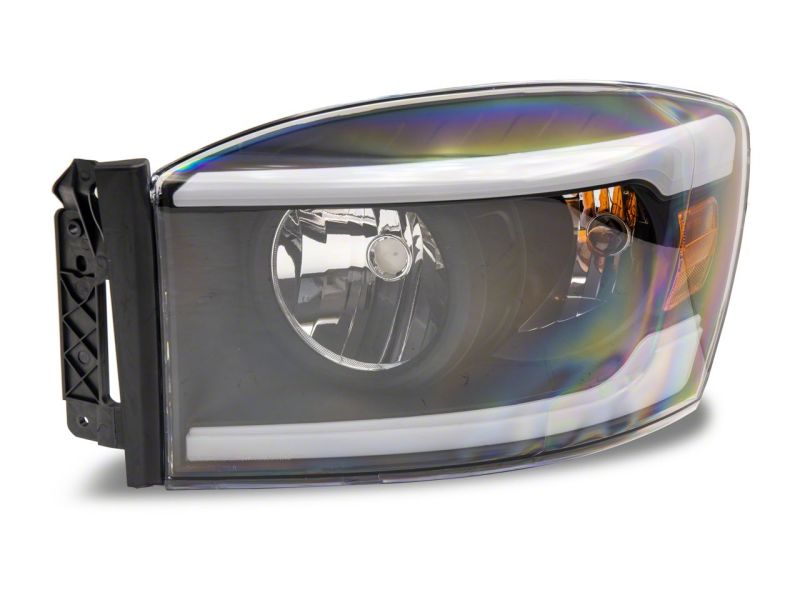 Load image into Gallery viewer, Raxiom 06-09 Dodge RAM 1500/2500/3500 Axial Headlights w/ SEQL LED Bar- Black Housing (Clear Lens)