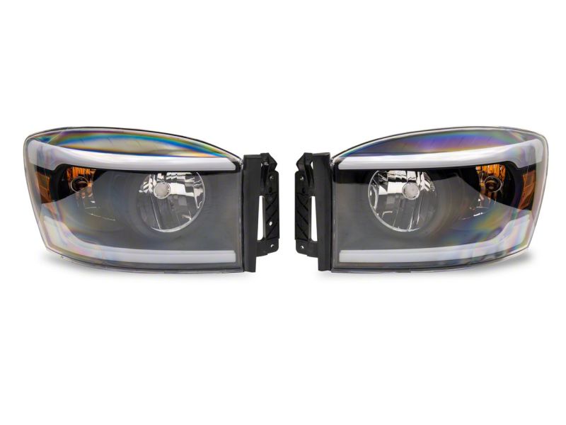 Load image into Gallery viewer, Raxiom 06-09 Dodge RAM 1500/2500/3500 Axial Headlights w/ SEQL LED Bar- Black Housing (Clear Lens)