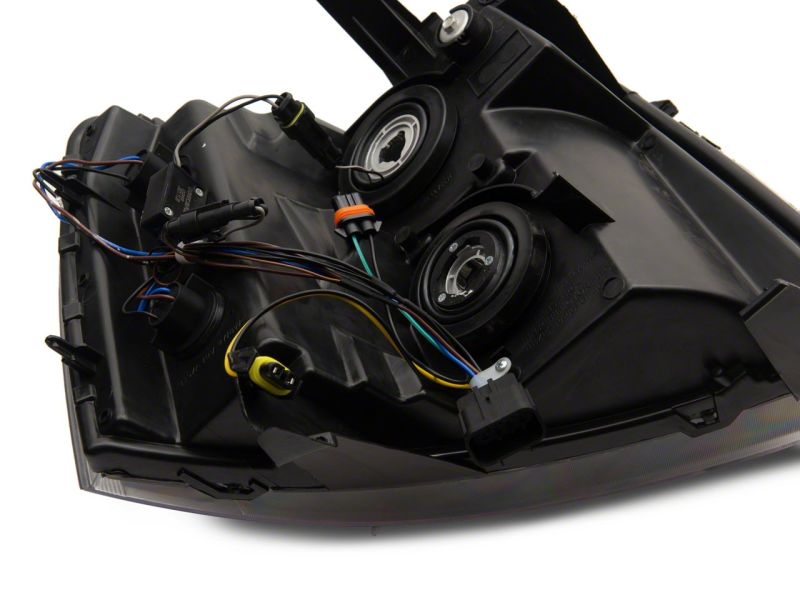 Load image into Gallery viewer, Raxiom 07-13 Chevrolet Silverado 1500 Axial Series Headlights w/ LED Bar- Black Housing (Clear Lens)