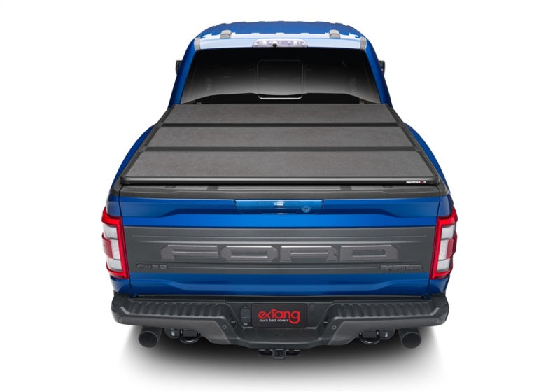 Load image into Gallery viewer, Extang 17-23 Nissan Titan w/Rail Sys. (5ft. 7in. Bed) Solid Fold ALX