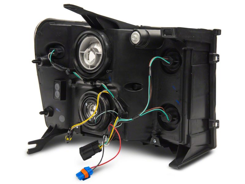 Load image into Gallery viewer, Raxiom 07-13 GMC Sierra 1500 Axial Series Headlights w/ LED Bar- Black Housing (Clear Lens)