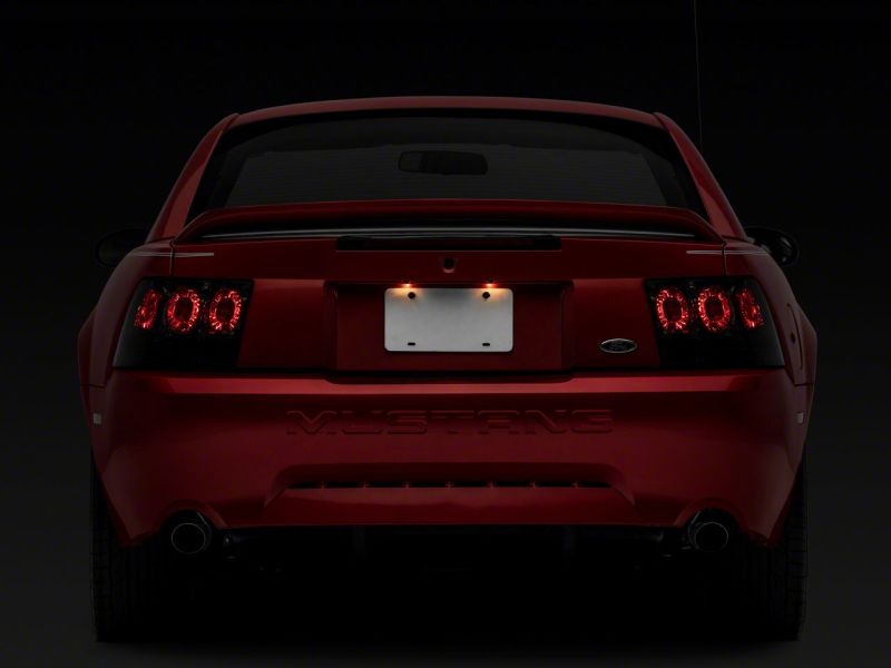 Load image into Gallery viewer, Raxiom 99-04 Ford Mustang Axial Series Altezza Style Tail Lights- Blk Housing (Smoked Lens)
