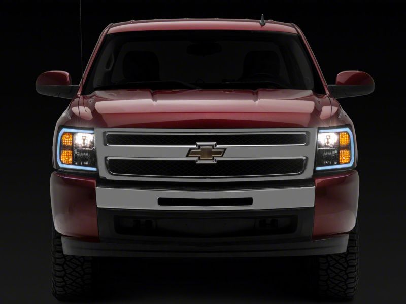 Load image into Gallery viewer, Raxiom 07-13 Chevrolet Silverado 1500 Axial Series Headlights w/ LED Bar- Black Housing (Clear Lens)