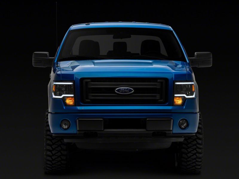 Load image into Gallery viewer, Raxiom 09-14 Ford F-150 Axial Series Headlight w/ SEQL LED Bar- Black Housing (Clear Lens)