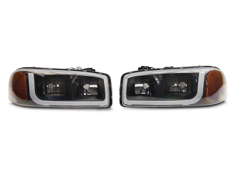 Load image into Gallery viewer, Raxiom 99-06 GMC Sierra 1500 Axial Series Headlights w/ LED Bar- Black Housing (Clear Lens)