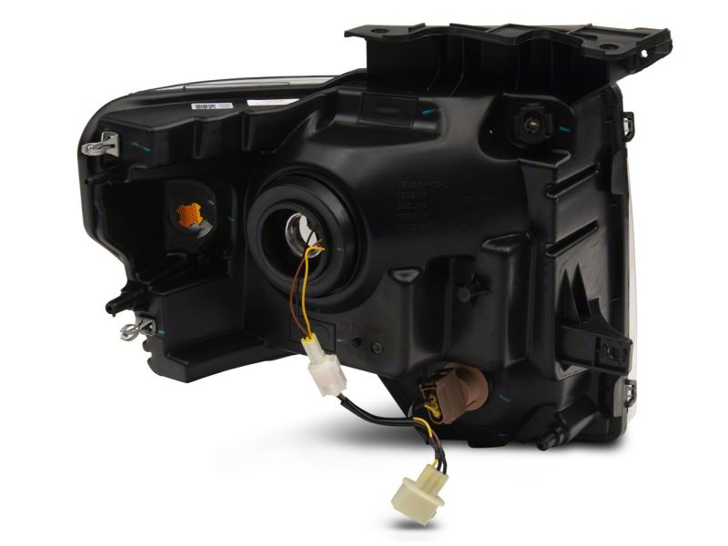 Load image into Gallery viewer, Raxiom 09-14 Ford F-150 Axial Series Headlight w/ SEQL LED Bar- Black Housing (Clear Lens)