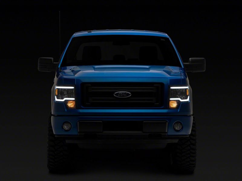 Load image into Gallery viewer, Raxiom 09-14 Ford F-150 Axial Series Headlights w/ LED Bar- Black Housing (Clear Lens)