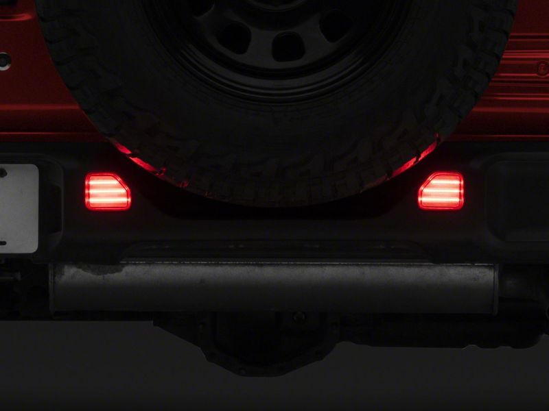 Load image into Gallery viewer, Raxiom 18-23 Jeep Wrangler JL Moab Rubicon Sahara Axial LED Rear Bumper Reflector Lights- Clear