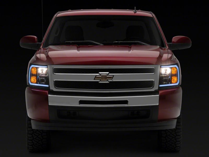 Load image into Gallery viewer, Raxiom 07-13 Chevrolet Silverado 1500 Axial Headlights w/ SEQL LED Bar- Black Housing (Clear Lens)