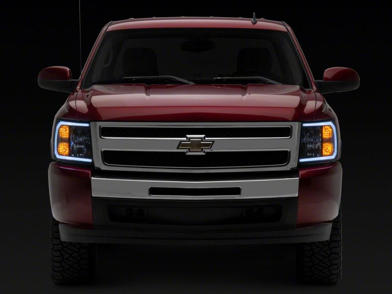Load image into Gallery viewer, Raxiom 07-13 Chevrolet Silverado 1500 Axial Headlights w/ SEQL LED Bar- Black Housing (Clear Lens)