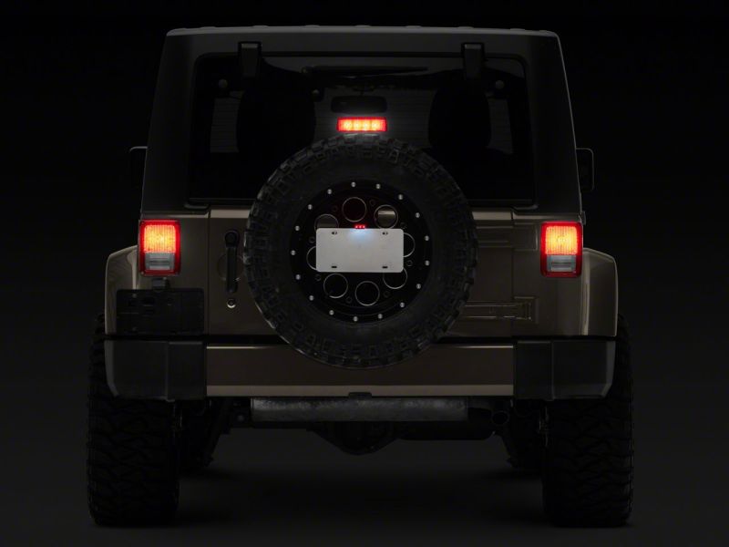 Load image into Gallery viewer, Raxiom 07-18 Jeep Wrangler JK Axial Series License Plate Bracket w/ LED Brake Light