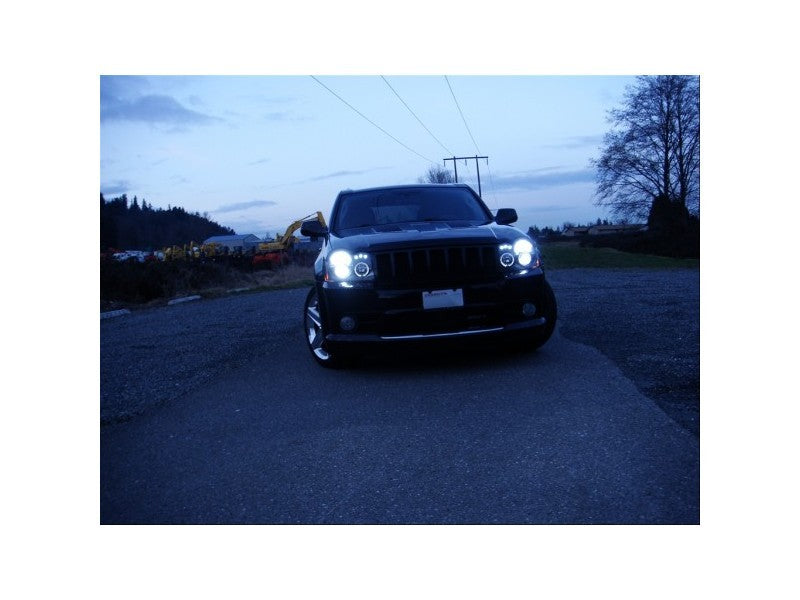 Load image into Gallery viewer, Spyder Jeep Grand Cherokee 05-07 Projector Headlights LED Halo LED Blk Low 9006 PRO-YD-JGC05-HL-BK