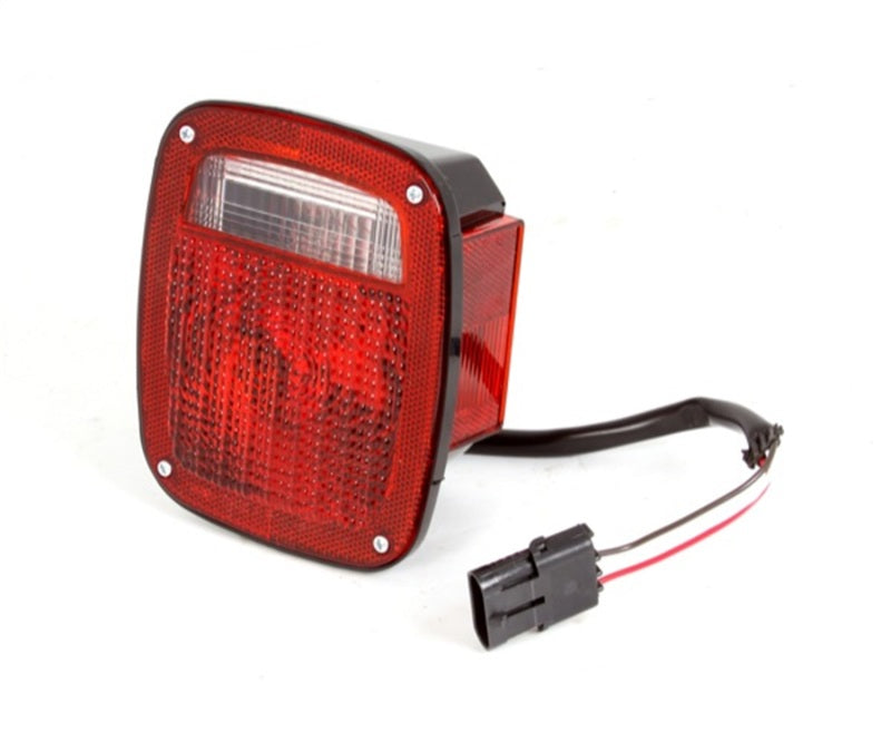 Load image into Gallery viewer, Omix Tail Light Black Housing RH 87-90 Jeep Wrangler