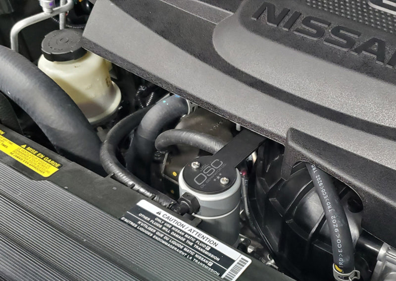 Load image into Gallery viewer, J&L 16-24 Nissan Titan 5.6L Passenger Side Oil Separator 3.0 - Clear Anodized