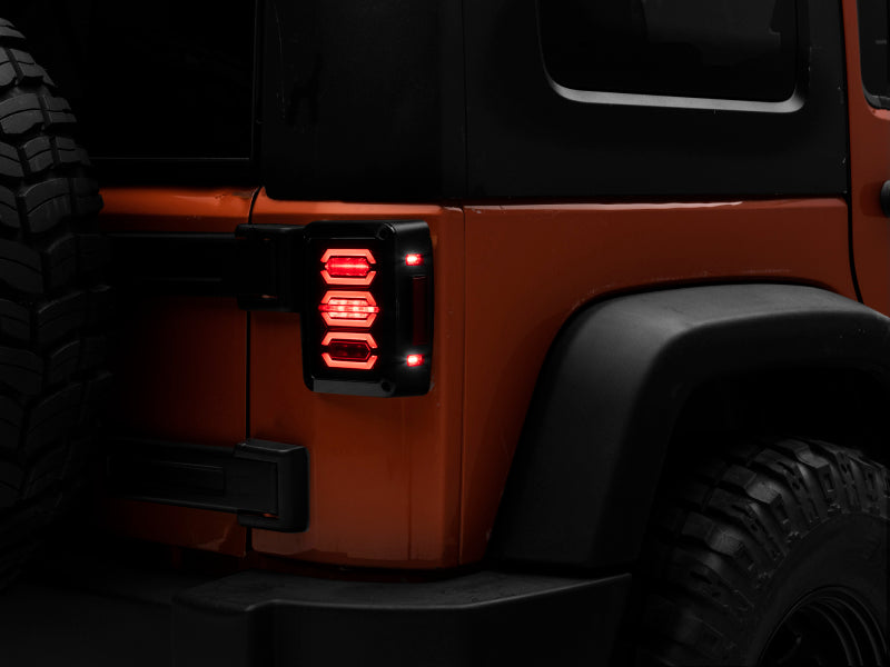 Load image into Gallery viewer, Raxiom 07-18 Jeep Wrangler JK LED Tail Lights- Black Housing (Smoked Lens)
