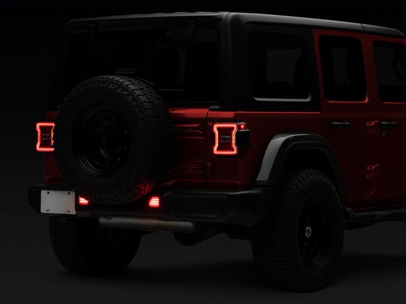 Load image into Gallery viewer, Raxiom 18-23 Jeep Wrangler JL Moab Rubicon Sahara Axial LED Rear Bumper Reflector Lights- Clear
