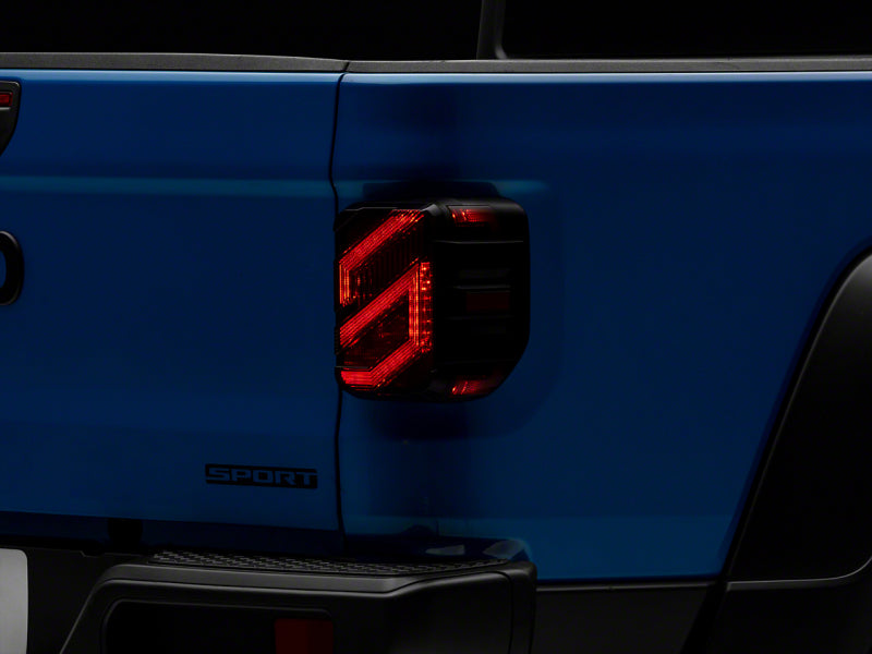 Load image into Gallery viewer, Raxiom 20-23 Jeep Gladiator JT Axial Series LED Tail Lights- Blk Housing (Smoked Lens)
