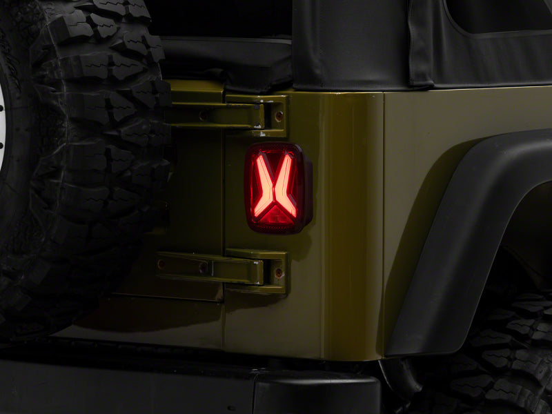 Load image into Gallery viewer, Raxiom 76-06 Jeep CJ7 Wrangler YJ &amp; TJ Gladiator LED Tail Lights- Blk Housing (Smoked Lens)
