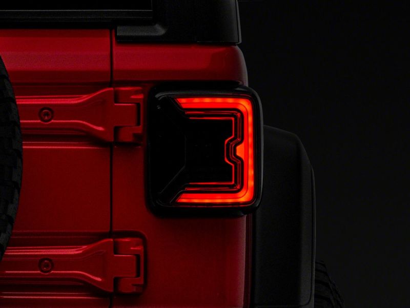 Load image into Gallery viewer, Raxiom 18-23 Jeep Wrangler JL Axial Series LED Tail Lights- Blk Housing (Smoked Lens)
