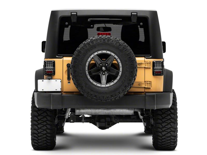 Load image into Gallery viewer, Raxiom 07-18 Jeep Wrangler JK Axial Series Lux LED Tail Lights- Blk Housing (Clear Lens)
