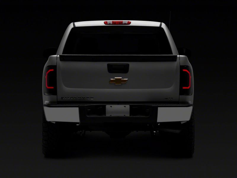 Load image into Gallery viewer, Raxiom 07-14 Chevrolet Silverado 1500 Axial Series LED Tail Lights- Blk Housing (Smoked Lens)
