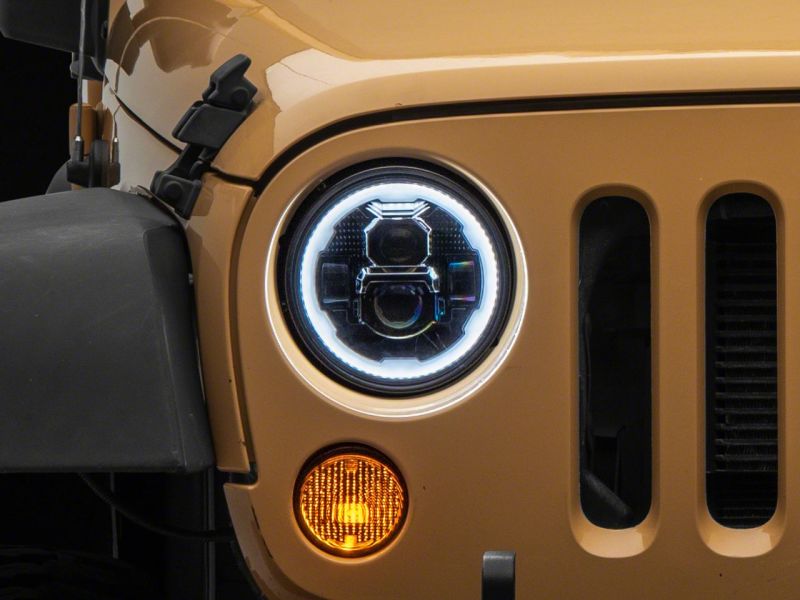 Load image into Gallery viewer, Raxiom 07-18 Jeep Wrangler JK Axial 7-In LED Headlights w/ DRL Turn Signals- Blk Housing (Clear)
