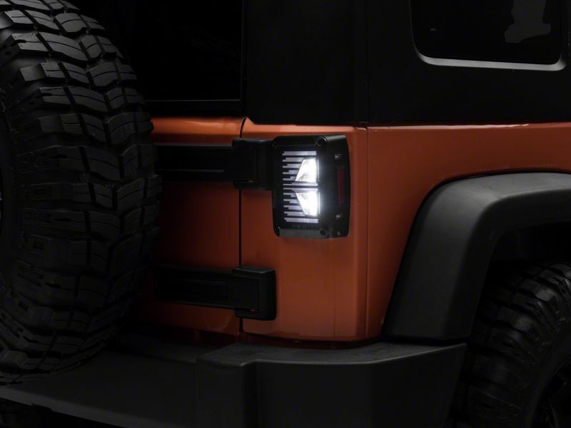 Load image into Gallery viewer, Raxiom 07-18 Jeep Wrangler JK Axial Series Vision LED Tail Lights- Blk Housing (Clear Lens)
