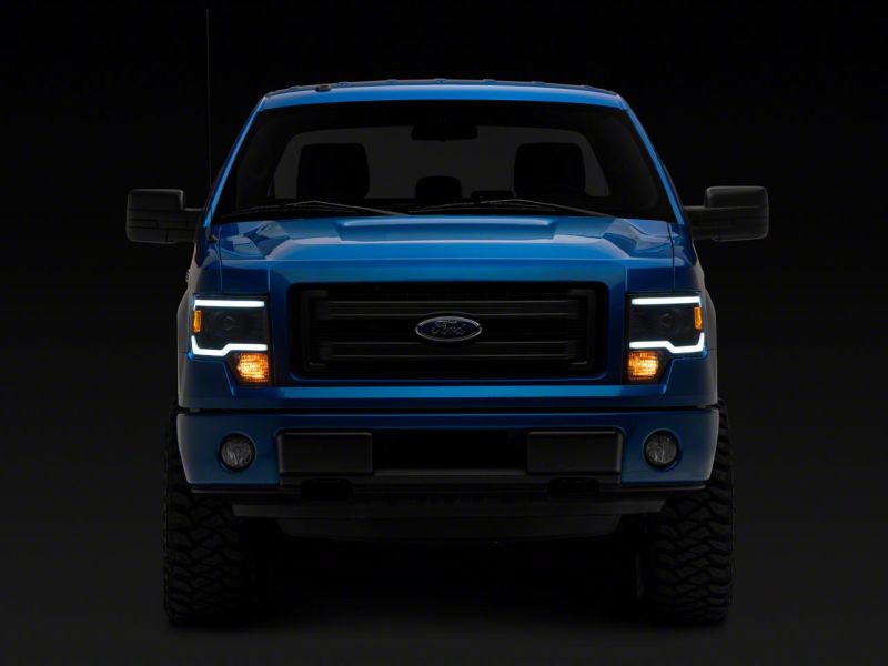 Load image into Gallery viewer, Raxiom 09-14 Ford F-150 Axial Series Projector Headlights w/ LED Light Bar- Blk Housing (Clear Lens)
