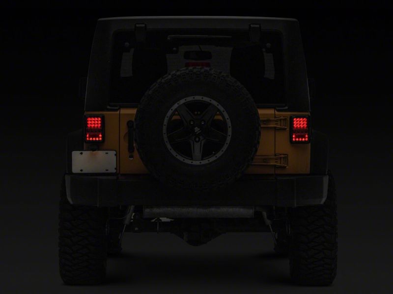 Load image into Gallery viewer, Raxiom 07-18 Jeep Wrangler JK Axial Series Lux LED Tail Lights- Blk Housing (Clear Lens)
