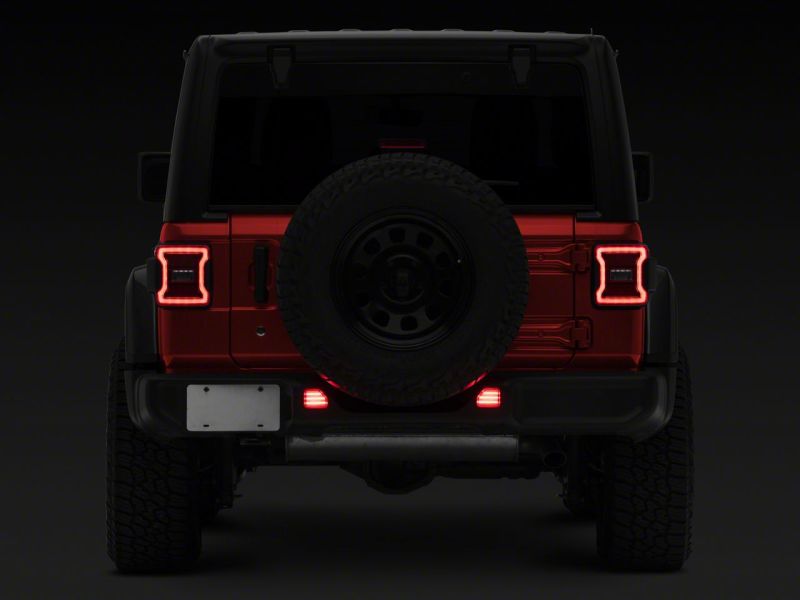 Load image into Gallery viewer, Raxiom 18-23 Jeep Wrangler JL Moab Rubicon Sahara Axial LED Rear Bumper Reflector Lights- Clear
