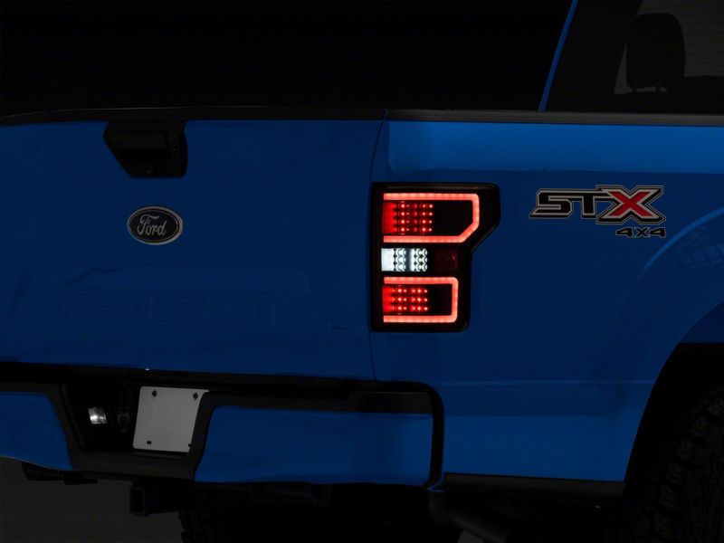 Load image into Gallery viewer, Raxiom 18-20 Ford F-150 Axial Series LED Tail Lights w/ SEQL Turn Signals- Blk Housing (Clear Lens)
