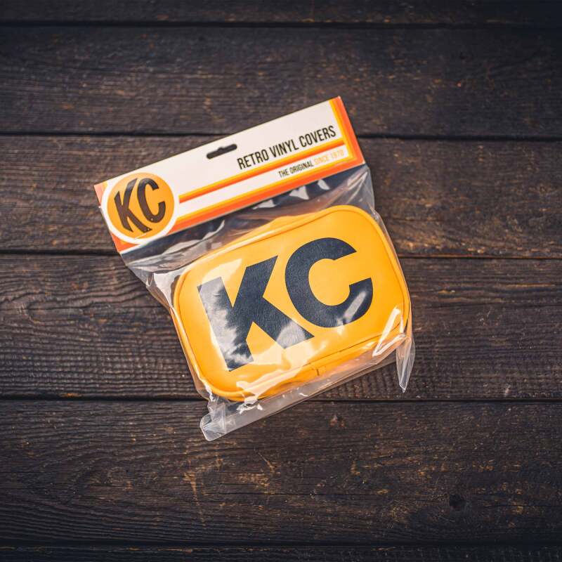 Load image into Gallery viewer, KC HiLiTES Retro 5in x 7in Rectangular Yellow Vinyl Light Cover w/ Black KC Logo (Pair)
