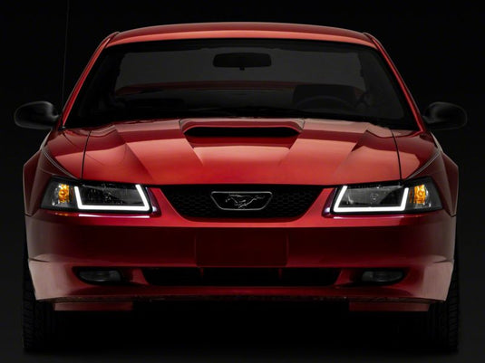 Raxiom 99-04 Ford Mustang Axial Series Headlights w/ LED Bar- Black Housing (Clear Lens)
